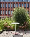 Hee Dining rust_Terrazzo Table sky grey red base.webp