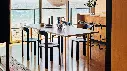 Two-Colour light grey wb lacquer valchromat tabletop_ochre powder coated steel_Rey Chair deep black wb lacquer beech_Hee Bar Stool black.webp